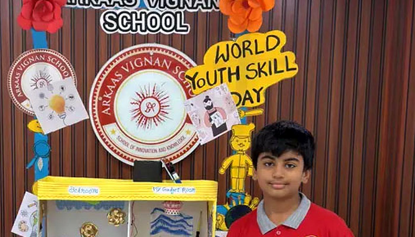 A student presenting a science model he built for a school skills exhibition