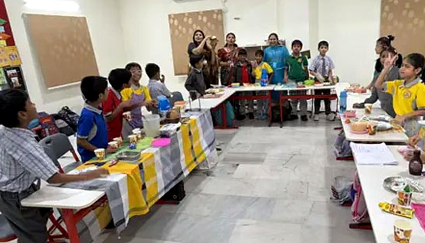 Nursery settling-in activities Young children taking part in a classroom activity in their early weeks at school