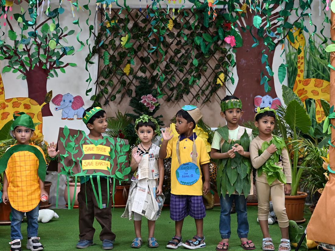 Young children at an early years celebration in costume