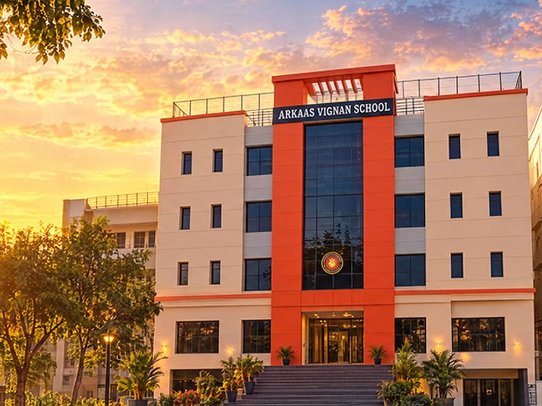 Arkaas Vignan School building exterior in Puppalguda at sunset
