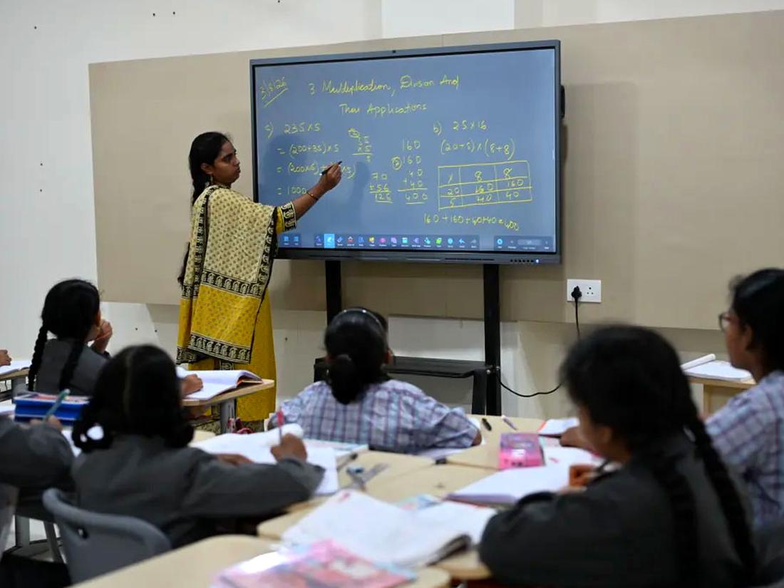 Teacher leading a lesson on the smart board Teacher leading a lesson on the smart board