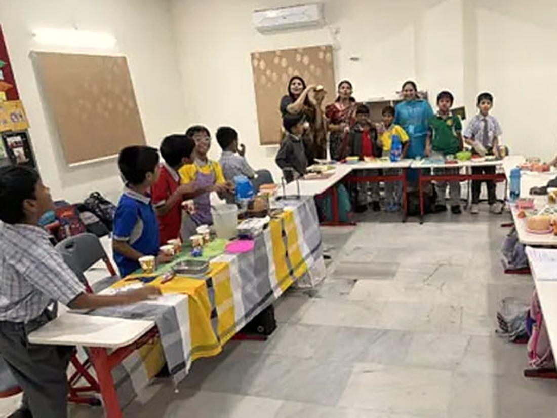 Students working together at tables during an activity session